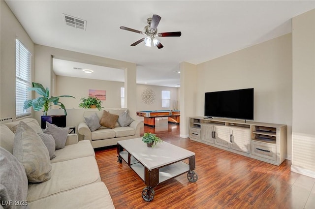 living room with wood-type flooring, plenty of natural light, pool table, and ceiling fan