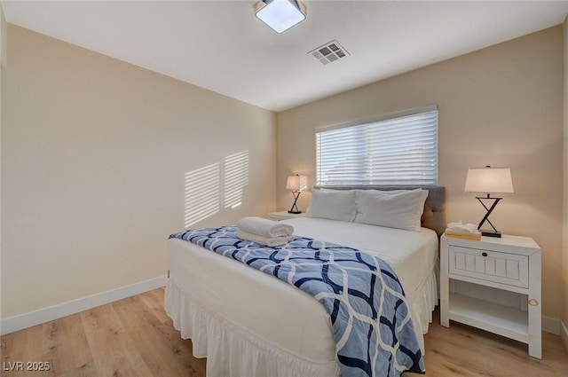 bedroom with light hardwood / wood-style floors