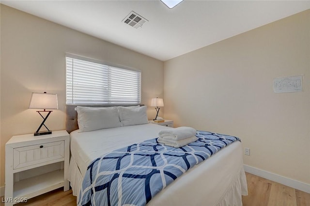 bedroom with light hardwood / wood-style floors