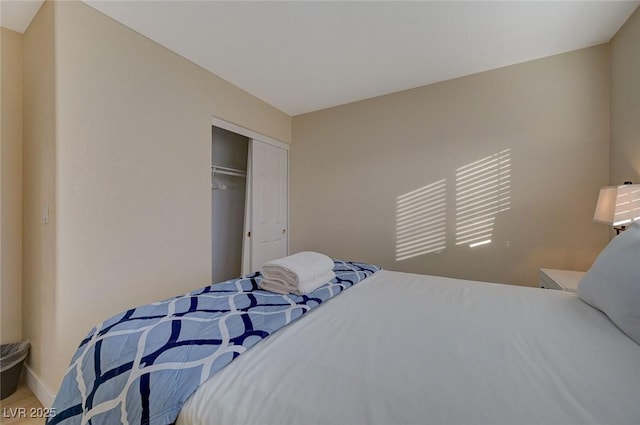 bedroom with carpet and a closet