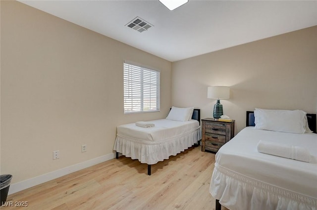 bedroom featuring light hardwood / wood-style floors