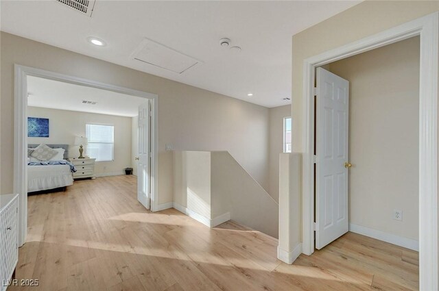 hall with light wood-type flooring