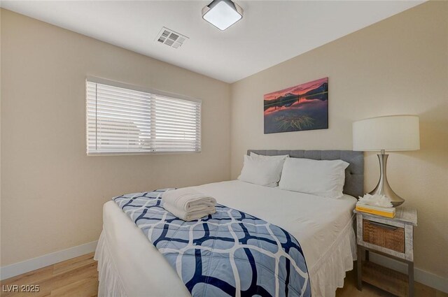 bedroom featuring hardwood / wood-style flooring