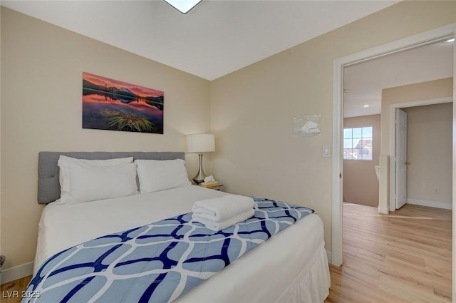 bedroom with light hardwood / wood-style flooring