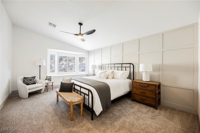 bedroom with ceiling fan, lofted ceiling, and carpet flooring