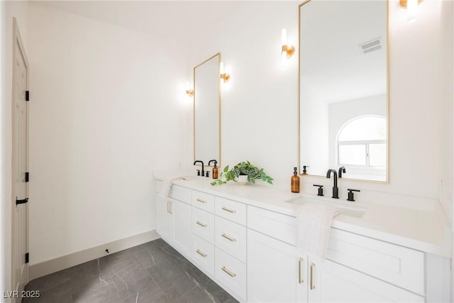 bathroom featuring tile patterned floors and vanity