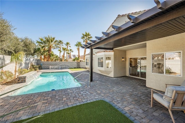 view of pool featuring pool water feature and a patio area