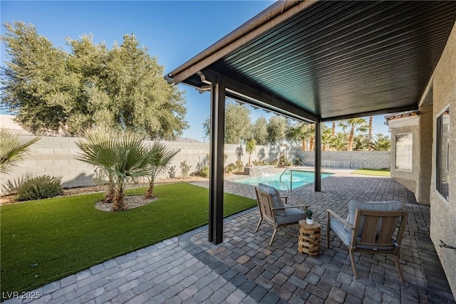 view of patio with a fenced in pool