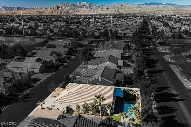 birds eye view of property with a mountain view