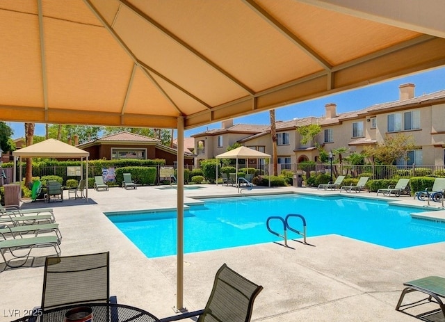 view of swimming pool featuring a gazebo and a patio