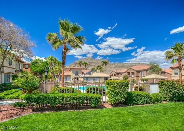 view of yard with a community pool