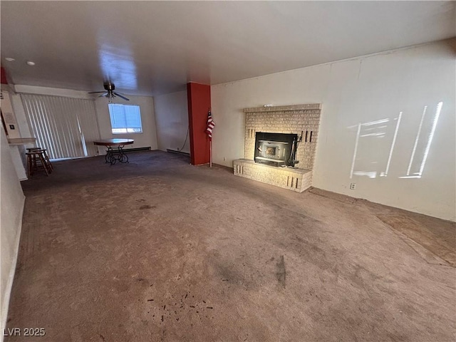 unfurnished living room with a baseboard heating unit, ceiling fan, and carpet flooring