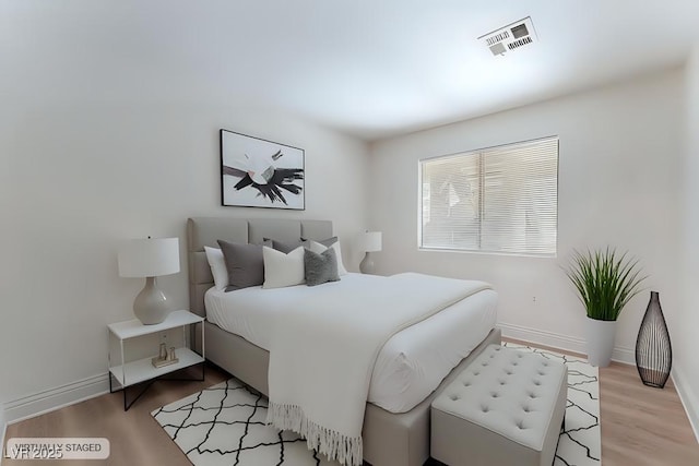 bedroom featuring light hardwood / wood-style floors