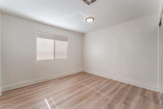 unfurnished room with light hardwood / wood-style floors