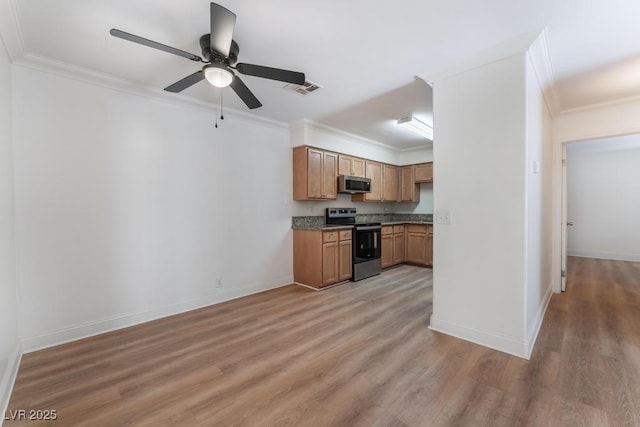 kitchen with hardwood / wood-style floors, ornamental molding, ceiling fan, and appliances with stainless steel finishes