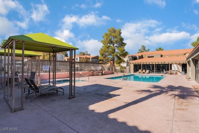 view of swimming pool featuring a patio