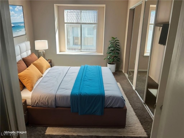 carpeted bedroom featuring a closet