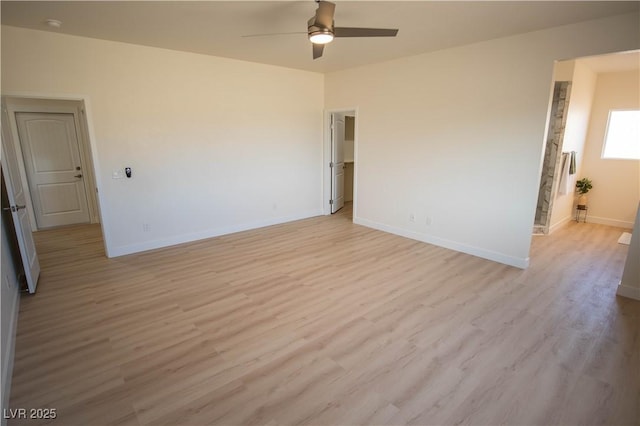 unfurnished room with light wood finished floors, ceiling fan, and baseboards