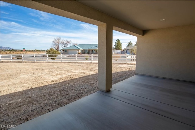 view of patio / terrace featuring fence