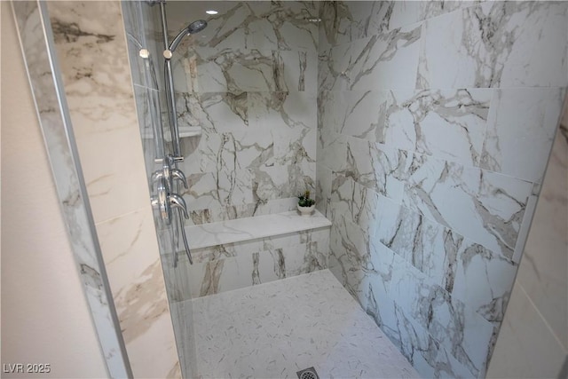 full bath with a marble finish shower