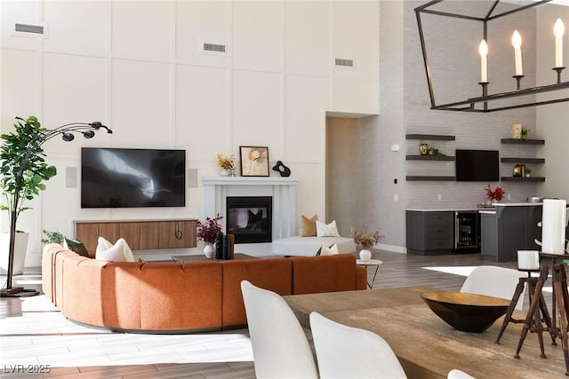 living room with a high ceiling and wine cooler