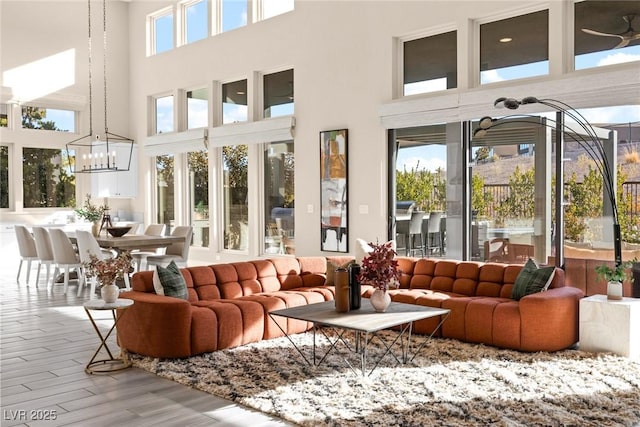 sunroom / solarium with an inviting chandelier and a wealth of natural light