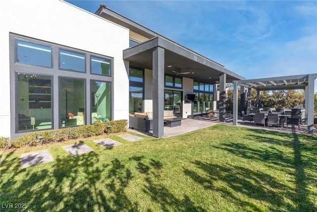 back of property featuring a pergola, a patio area, outdoor lounge area, and a lawn