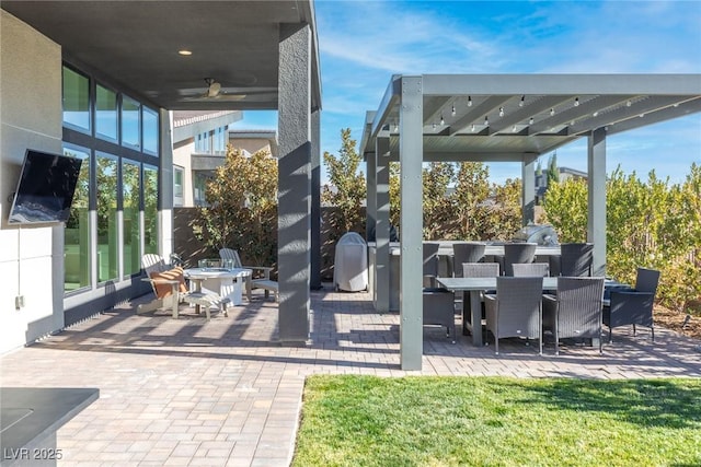 view of patio featuring ceiling fan