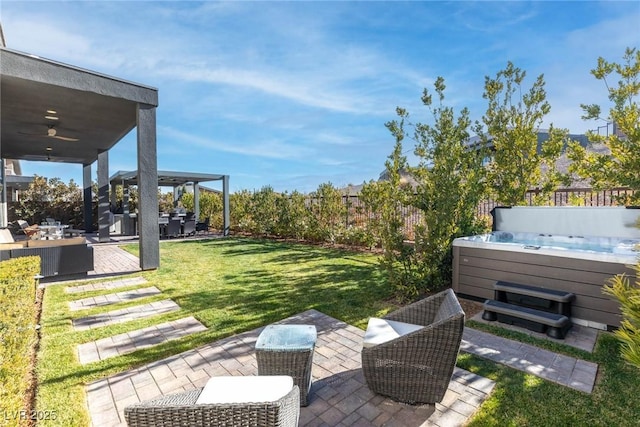 view of yard featuring a gazebo, ceiling fan, a hot tub, and a patio area