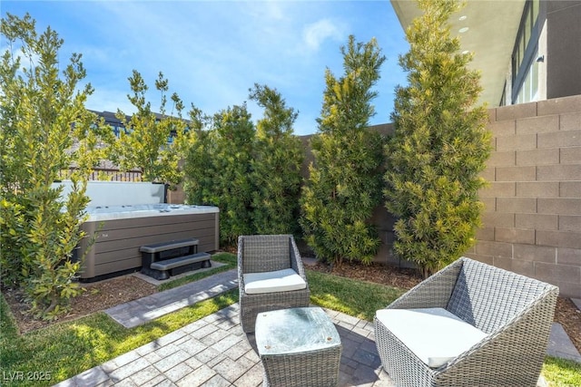 view of patio with a hot tub