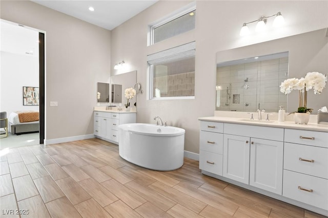 bathroom with vanity and separate shower and tub