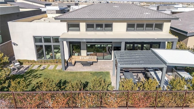 rear view of property featuring an outdoor hangout area and a lawn