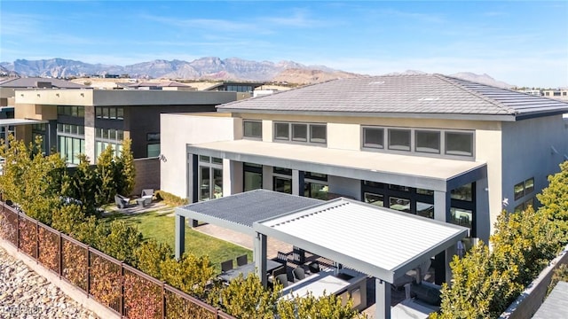 back of house featuring a mountain view