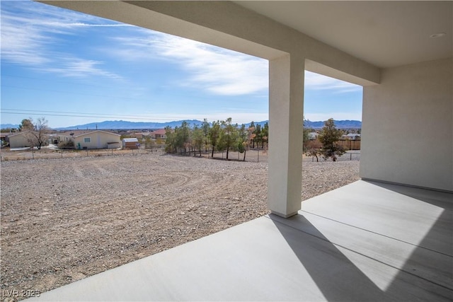 view of yard with a patio area and a mountain view