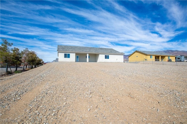 single story home with fence