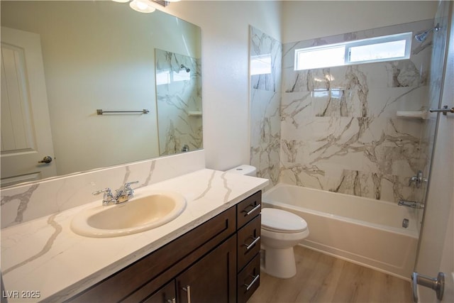 full bath featuring shower / bathtub combination, toilet, vanity, and wood finished floors