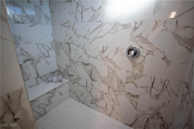 bathroom featuring tiled shower