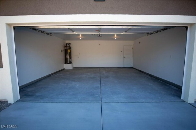 garage featuring strapped water heater, baseboards, and a garage door opener