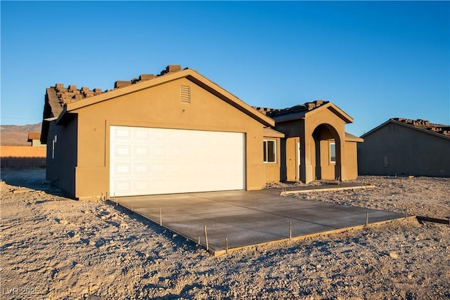 view of front of property with a garage