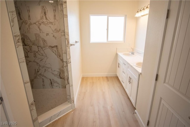 5821 Genoa Ave, Pahrump, NV 89060 - full bath with double vanity, wood finished floors, a marble finish shower, a sink, and baseboards