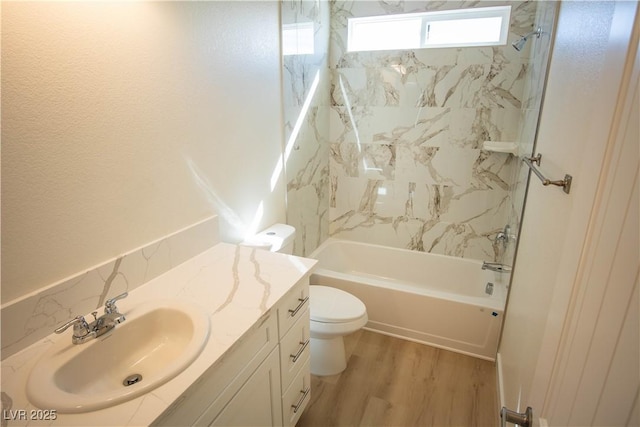 5821 Genoa Ave, Pahrump, NV 89060 - full bathroom with wood finished floors, toilet, vanity, and shower / bathtub combination