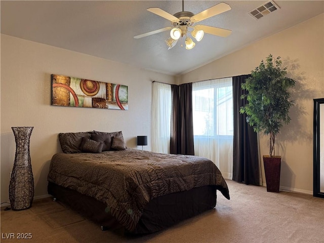 bedroom with lofted ceiling, light carpet, and ceiling fan