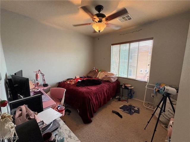 bedroom with visible vents, a ceiling fan, and carpet