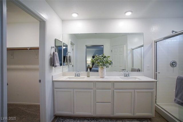 bathroom with vanity and walk in shower