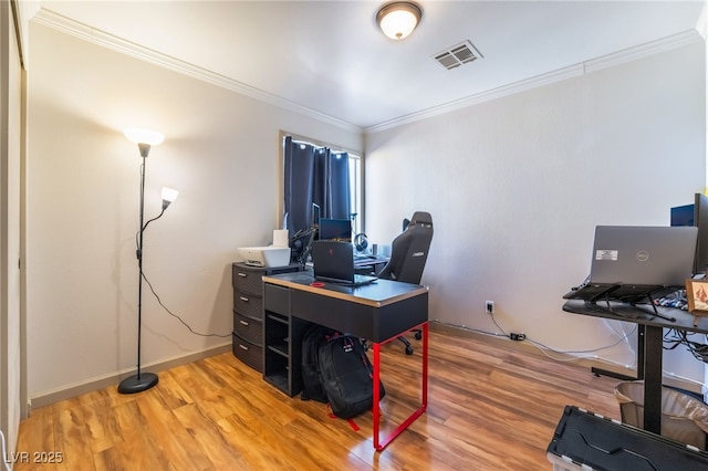 office space featuring hardwood / wood-style floors and crown molding