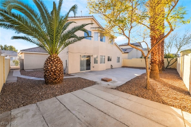 back of property featuring a patio