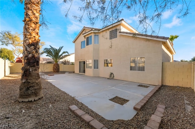 rear view of property featuring a patio