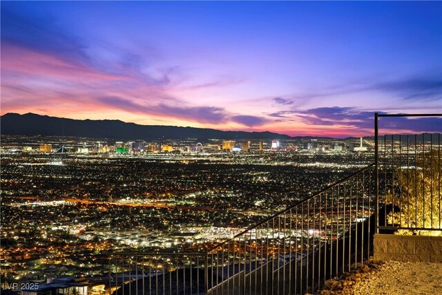 property's view of city featuring a mountain view