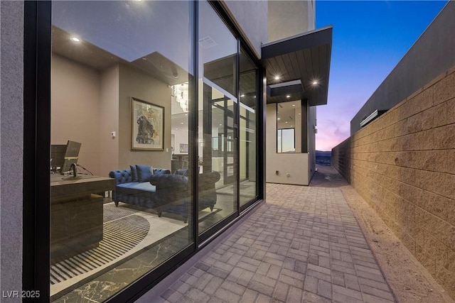 view of patio terrace at dusk