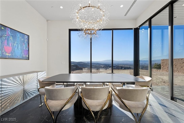 dining room with a chandelier, visible vents, a mountain view, and recessed lighting